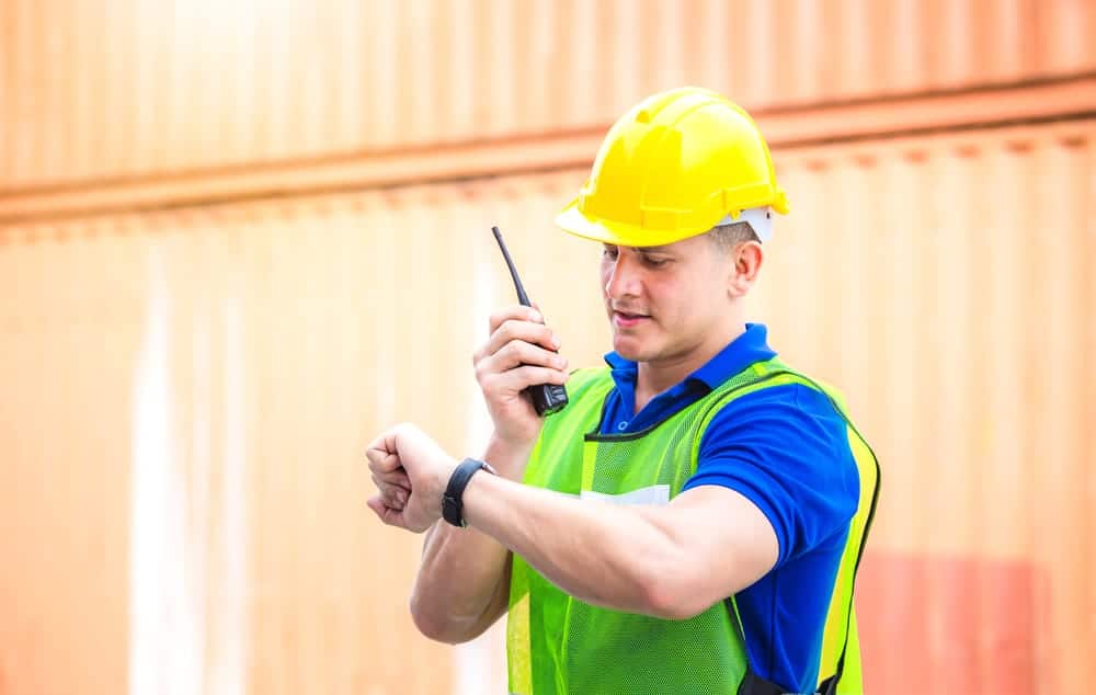 how to prevent buddy punching: construction supervisor monitoring time on-site.